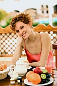 Young woman eating breakfast