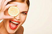 Woman with a slice of lemon