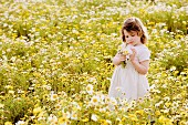 Girl in wildflower meadow