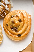 A puff pasty raisin buns with icing sugar