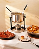 Cheese Fondue with salami and bread cubes