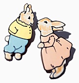 Two Beatrix Potter-style Easter bunny cookies (illustration)