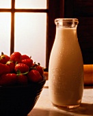 Fresh Bottle of Milk; Strawberries