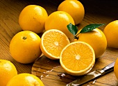 Whole Oranges with One Halved Orange