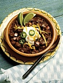 Bowl of Beef Chili; Lime Wedges
