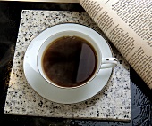 Cup of Coffee with Newspaper