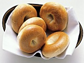 Plain Bagels on a Cloth Napkin in a Bowl