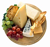 Cheese and Crackers; Grapes on a Wooden Platter