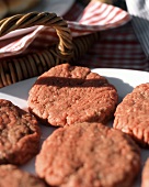Raw Hamburgers on a Plate Ready to Be Grilled