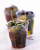 Caper Berries in Colored Glasses