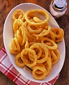 Onion Rings on a Plate with a Salt Shaker
