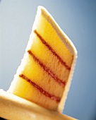 A Slice of Yellow Cake Layered with Rasberry Puree