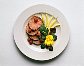 Sliced Beef with Wax Beans and a Flower Garnish