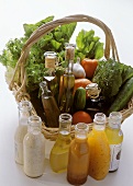 Salad Ingredients in a Basket; Assorted Oils and Dressings