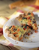 Two Slices of Vegetable Quiche in Quiche Dish