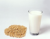 A Glass of Soy Milk with a Pile of Soybeans