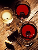 Two Glassed of Red Wine and a Glass of White Wine
