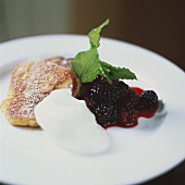 Pancake with Powdered Sugar and Fresh Blackberries