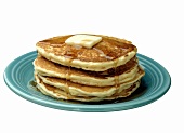 A Stack of Buttered Pancakes with Syrup