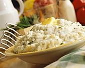 A Bowl of Chive Mashed Potato with Melting Butter