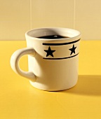 Black Coffee in a Mug with Stars