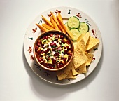 A Bowl of Chili with Tortilla Chips and Veggies