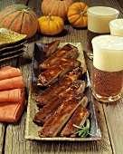 Porter Glazed Spare Ribs with Pumpkins and Mugs of Porter