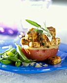 Chicken pieces with herbs in oven-baked potato with green beans