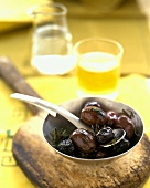 Grilled olives in metal bowl