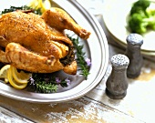 Stuffed chicken on pewter serving plate