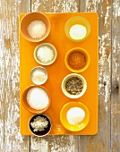 Assorted Types of Sea Salts on an Orange Tray