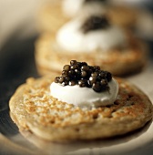 Blinis with sour cream and caviare