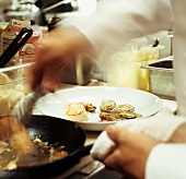 Chef preparing a seafood dish