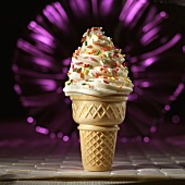 A Vanilla Soft Serve Ice Cream Cone with Sprinkles