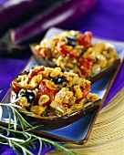 Stuffed aubergines with tomatoes, olives and garlic