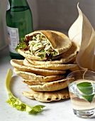 Pita bread filled with crab salad; mineral water