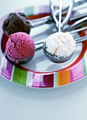 Three different ice creams in ice cream scoops