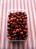 Cranberries in plastic container