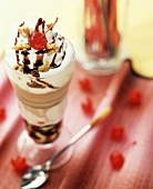 Banana split with walnuts and cocktail cherry