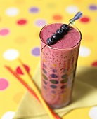 Blueberry smoothie with skewered blueberries