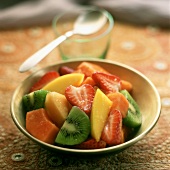 Fruit salad with exotic fruit and strawberries