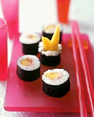 Maki Sushi with Mango on a Fuscia Platter with Chopsticks