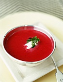 A Bowl of Beet Soup with Creme Fraiche and Parsley