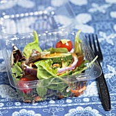 Small Salad in a To-go Container with a Plastic Fork