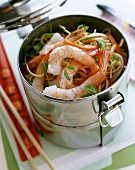 Asian pan-cooked noodles with shrimps in a food storage box