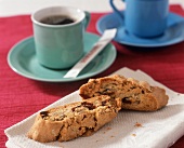 Cranberry and Hazelnut Biscotti on Linen with a Cup of Coffee