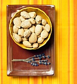 A Bowl of Almonds with a Sprig of Lavender