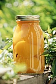Pickled peaches in screw-top jar
