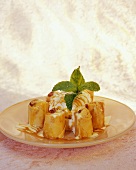 Vanilla ice cream with caramel sauce & pastries with fruit filling
