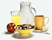 A Complete Breakfast with Blueberry Granola, Fruit, Juice and Coffee